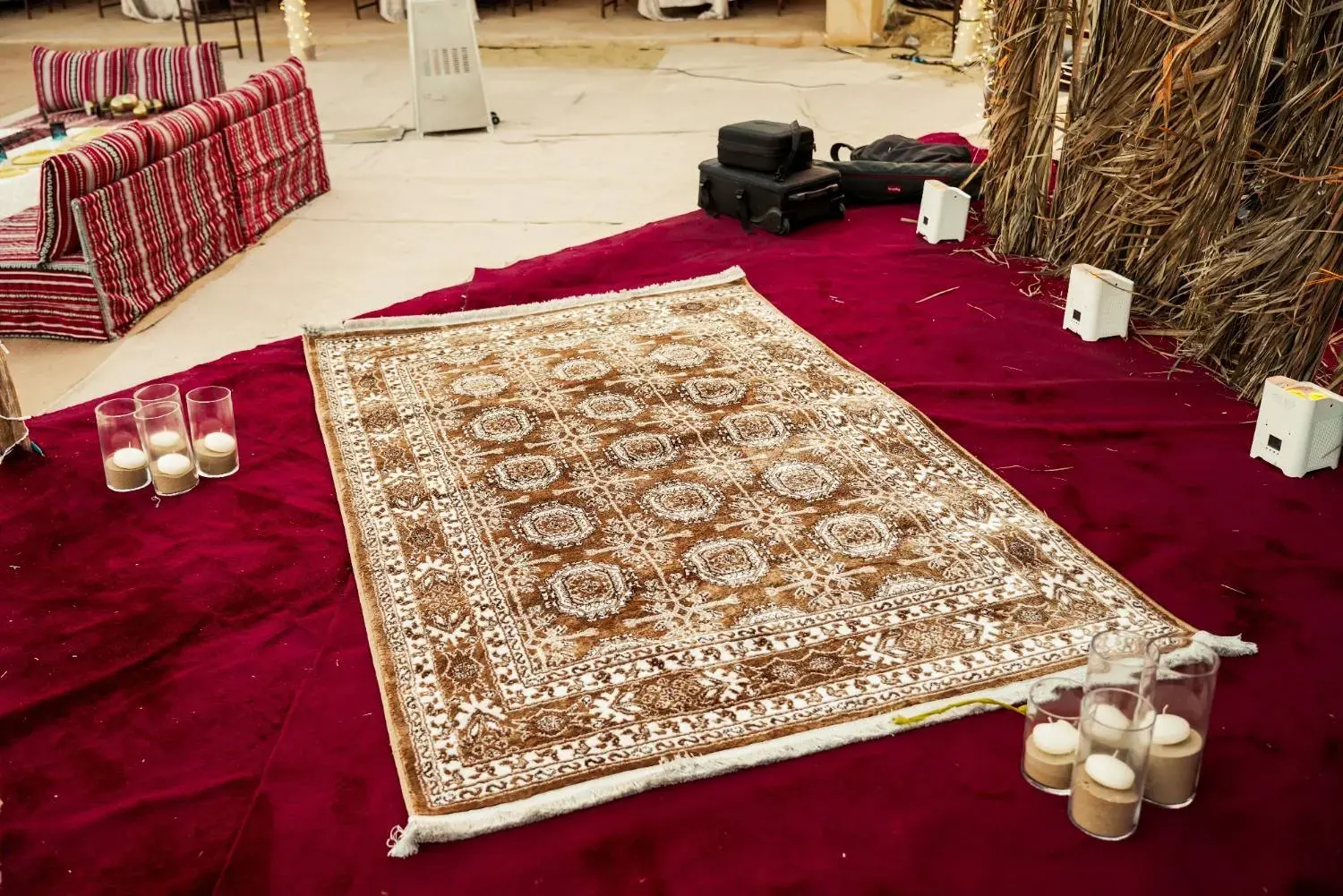 Persian rug and candles at the stage edge