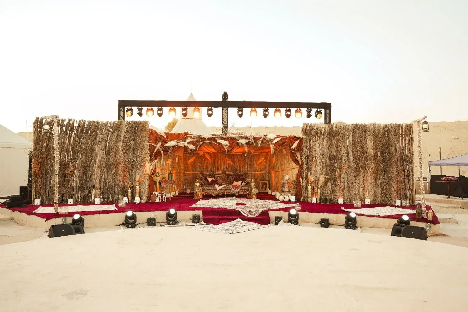 Palm-frond and brass stage at the camp in Al Khatim