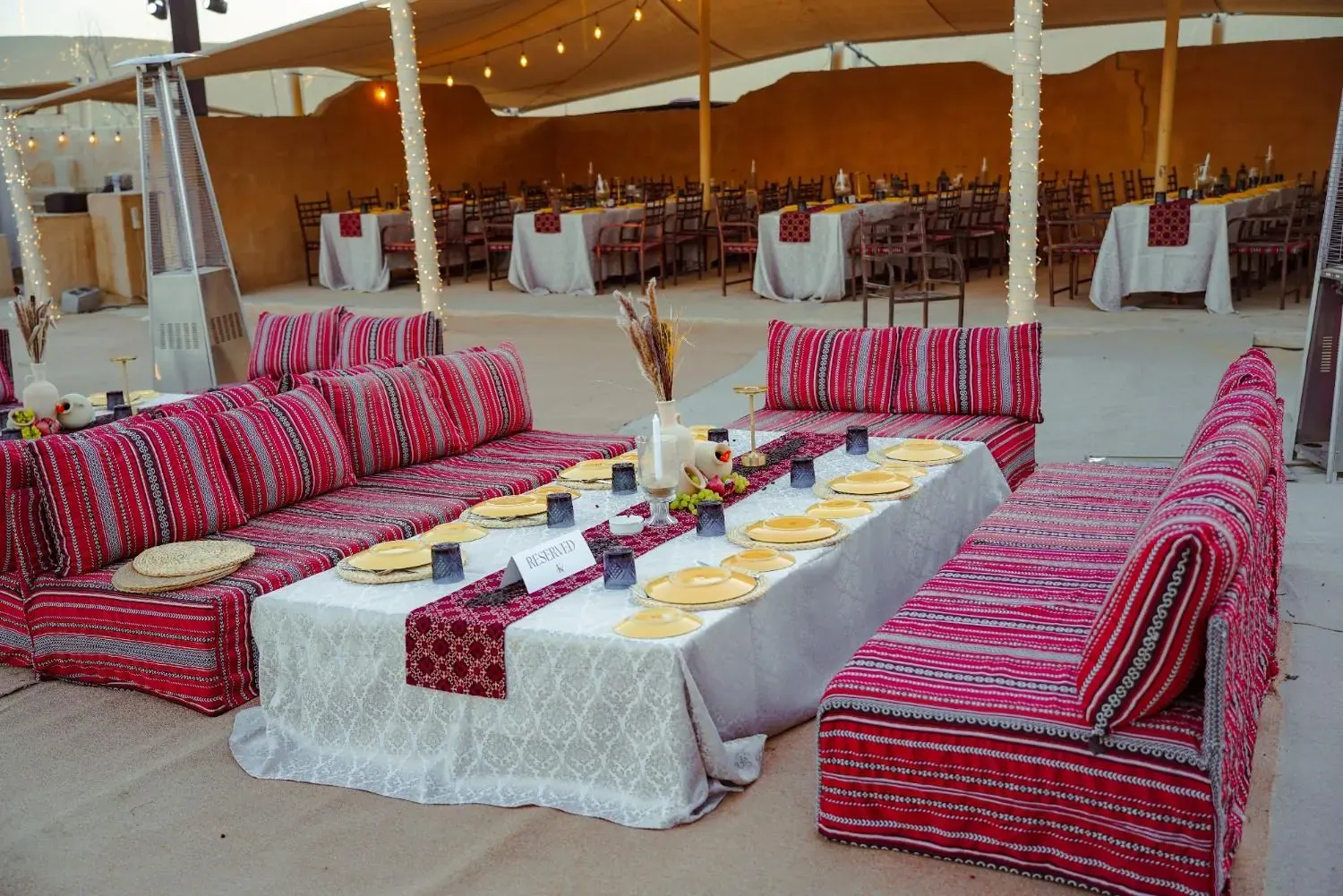 Long table with red sadu seating