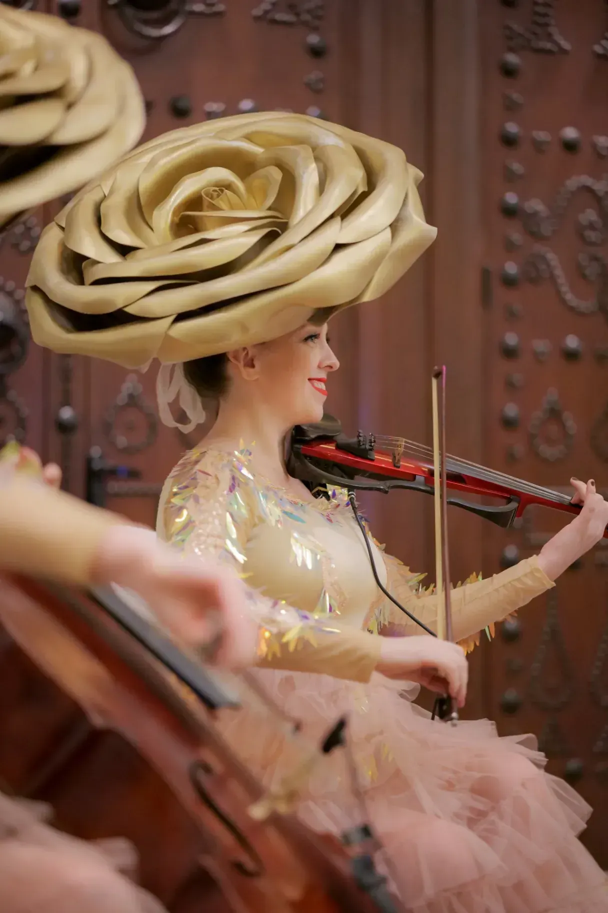 Violinist in a rose hat