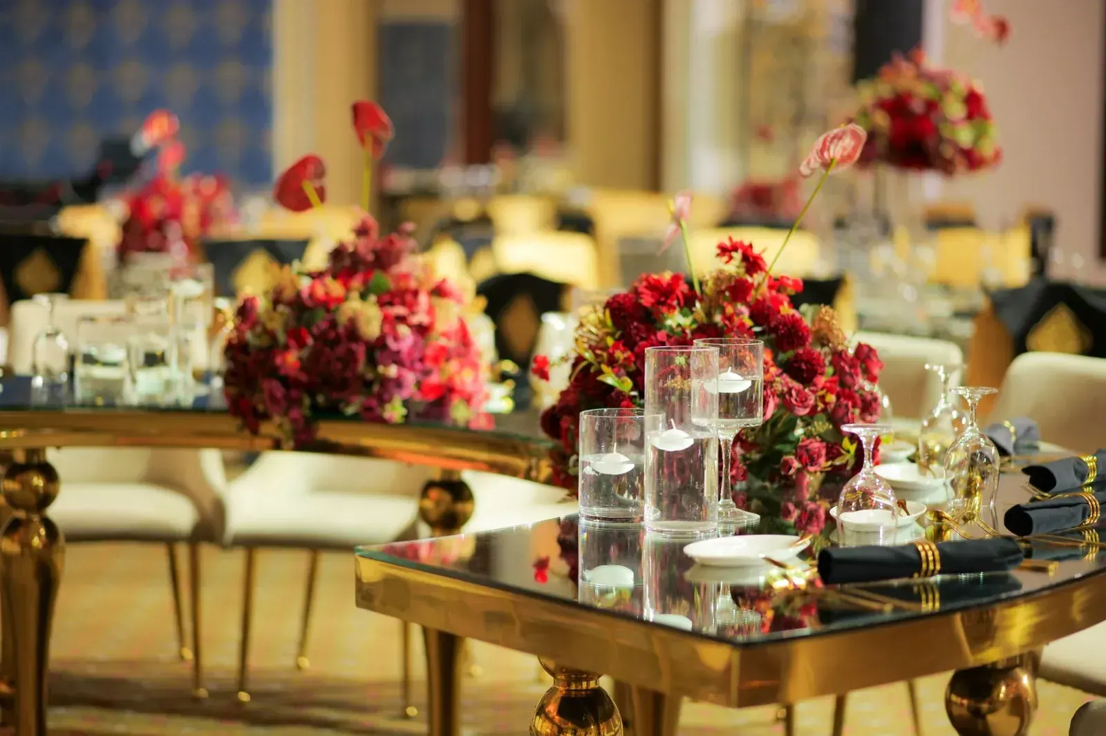 Crimson florals on a gold table
